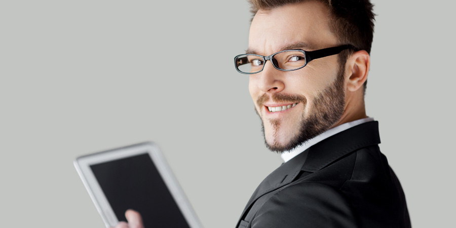 A smiling man with a tablet